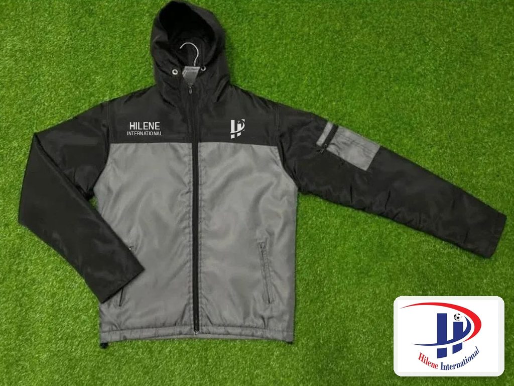 Hooded team windbreaker jacket in black and grey, front view with full zip and sleeve pocket